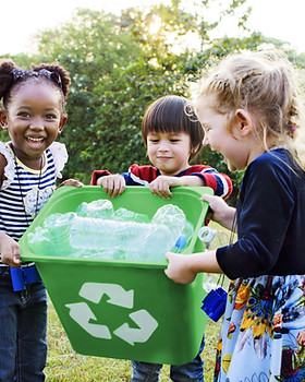 Girls Carrying a Recycling Bin